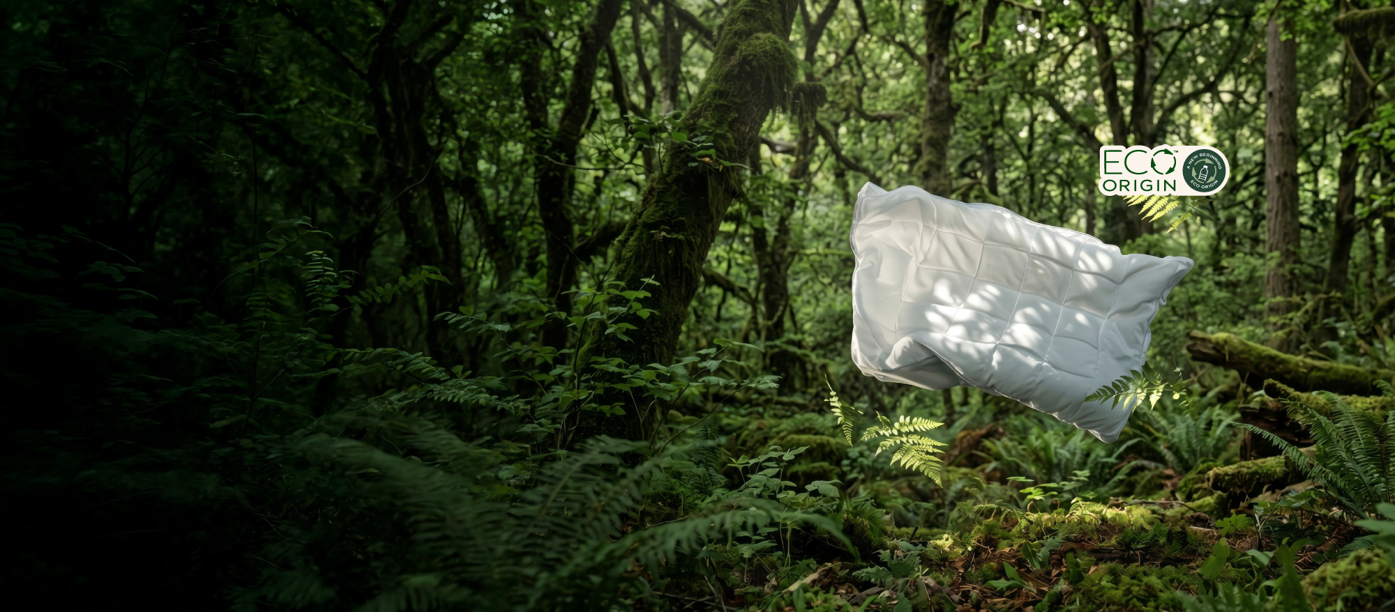 A white pillowtop mattress topper floating in a lush, green forest